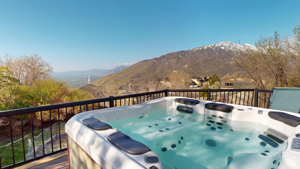 Wooden terrace featuring a mountain view
