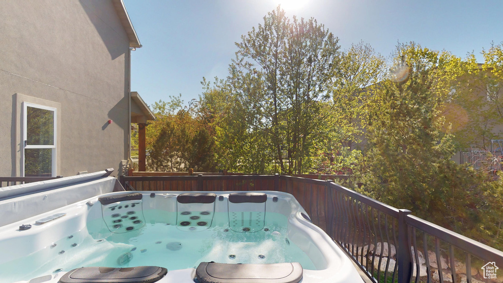 Wooden deck with a hot tub
