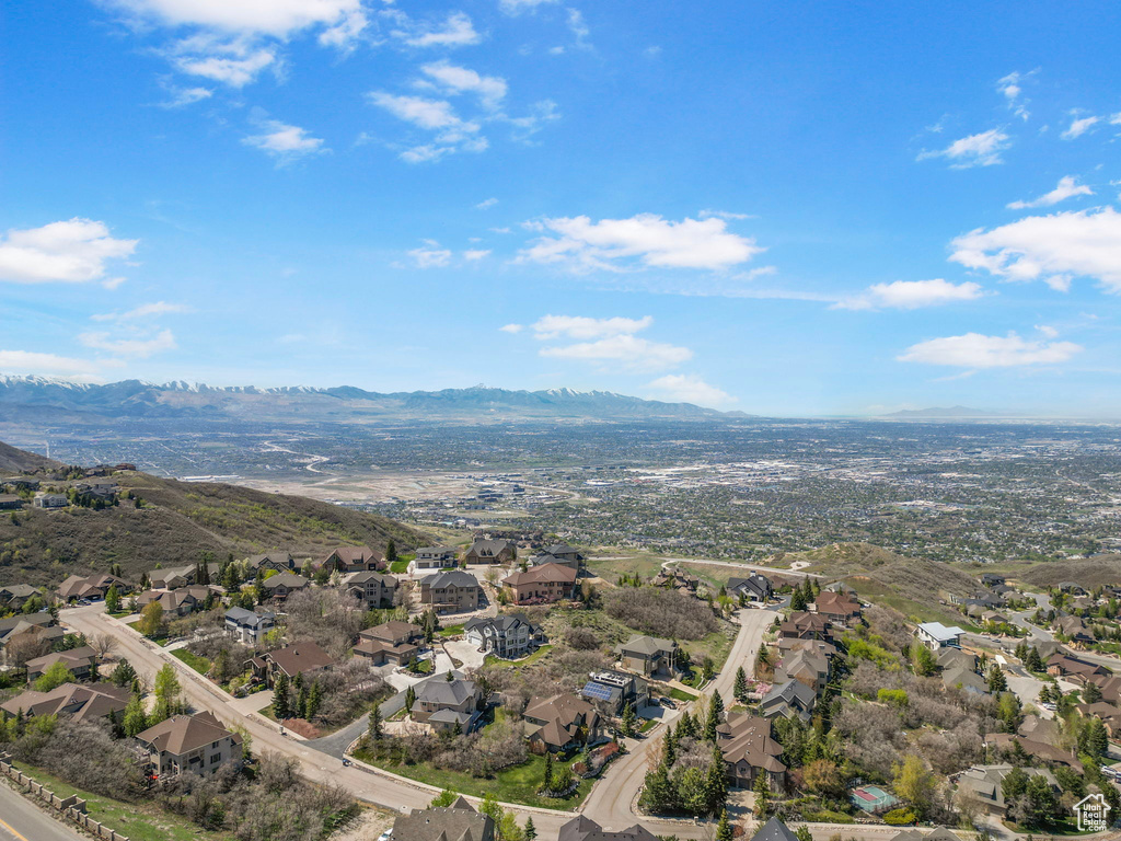 Birds eye view of property with a mountain view and a residential view