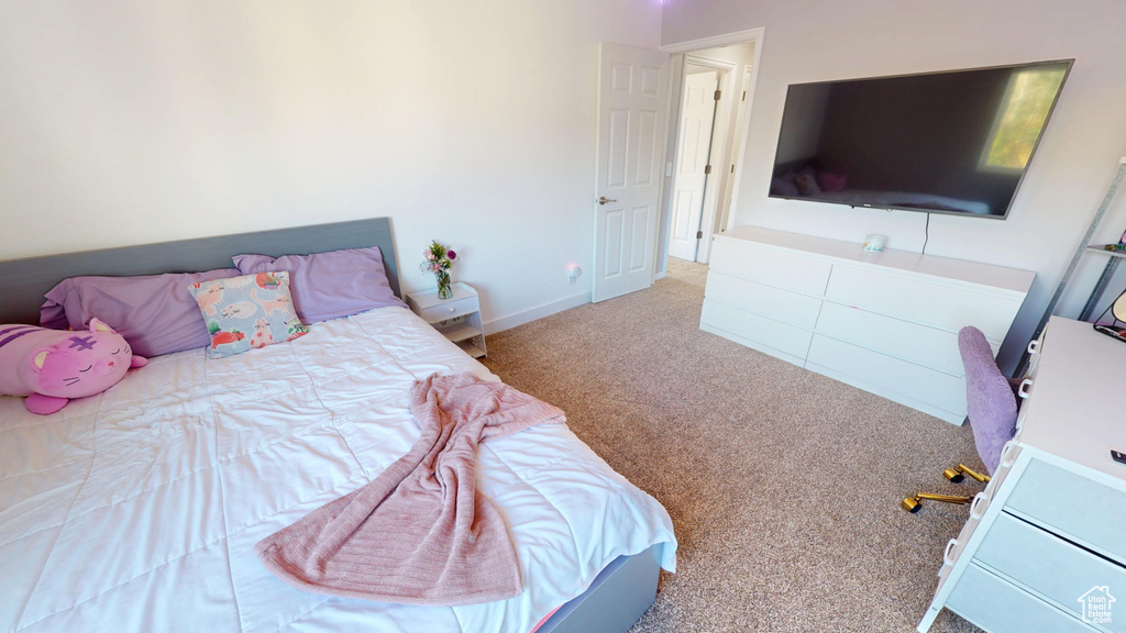 Carpeted bedroom with baseboards