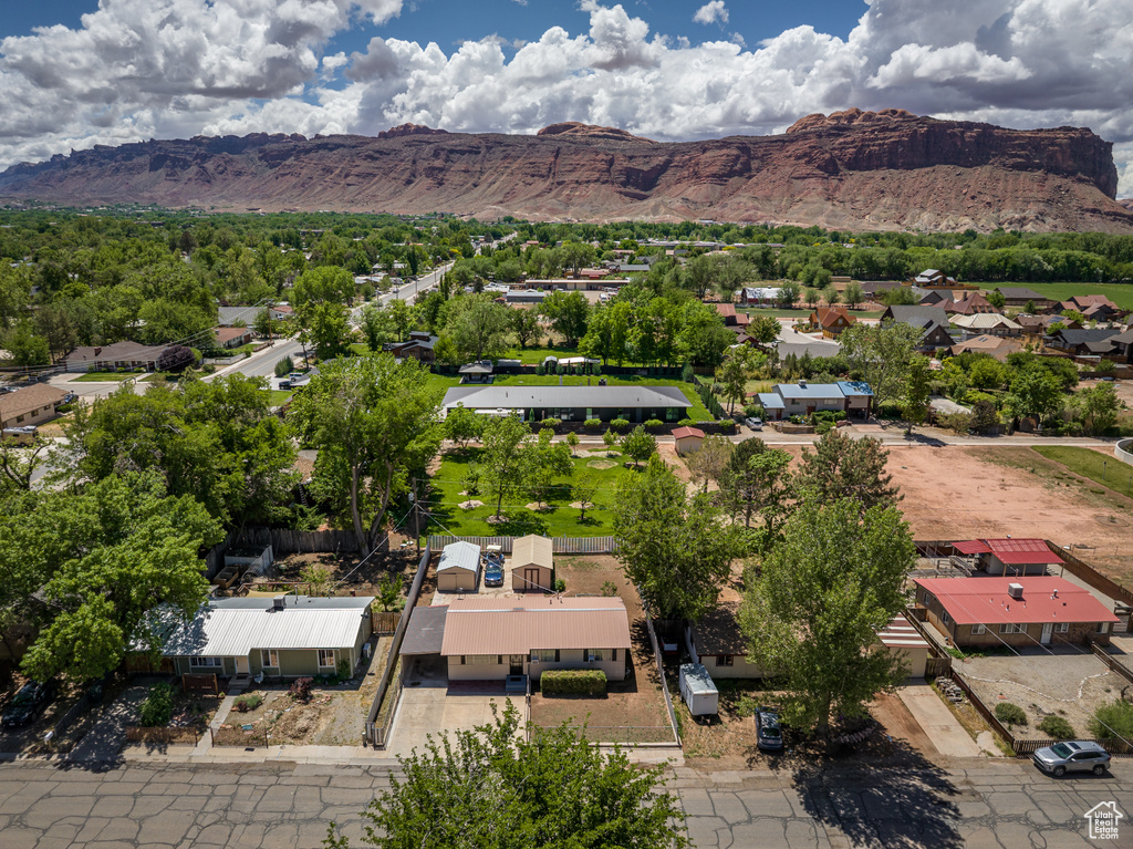 Aerial perspective of suburban area with a mountain backdrop