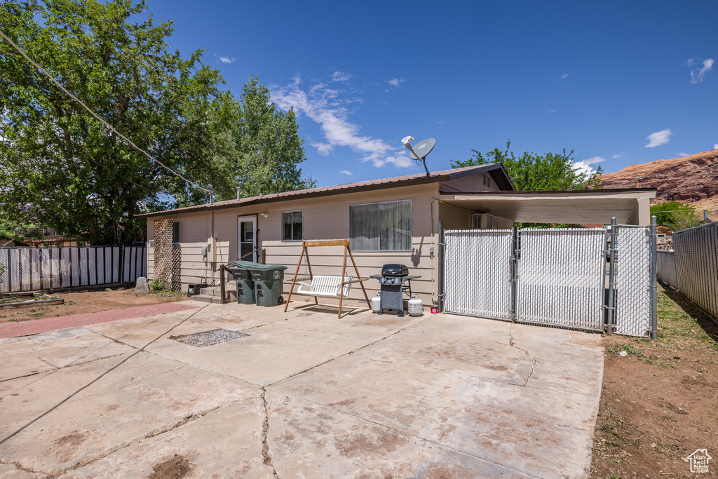 View of front of home featuring a gate and fence