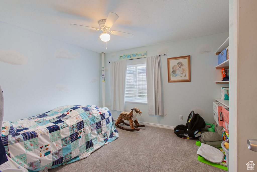 Bedroom featuring carpet and a ceiling fan