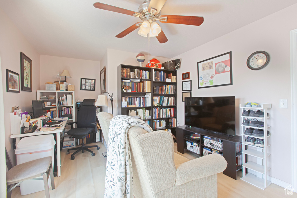 Office space featuring wood finished floors and a ceiling fan