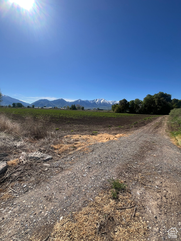 View of mountain background featuring rural landscape