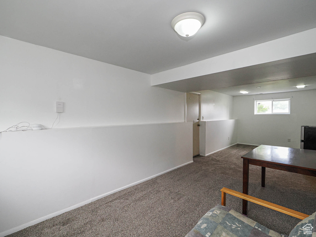 Unfurnished office with carpet and baseboards