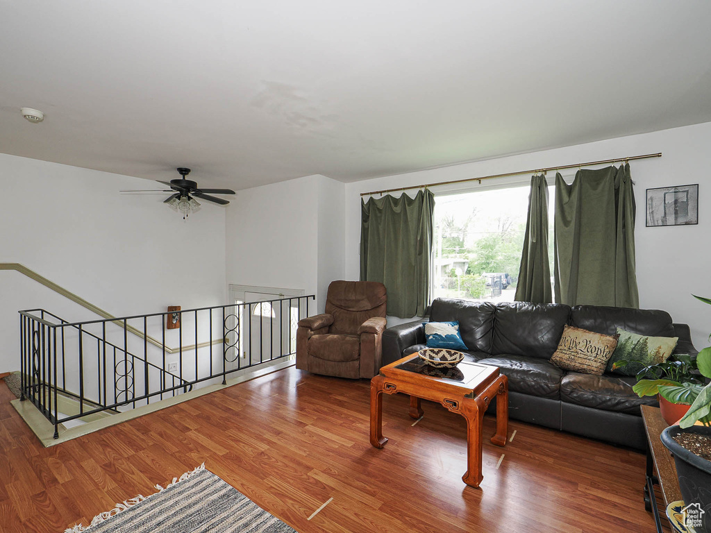 Living area featuring wood finished floors and ceiling fan