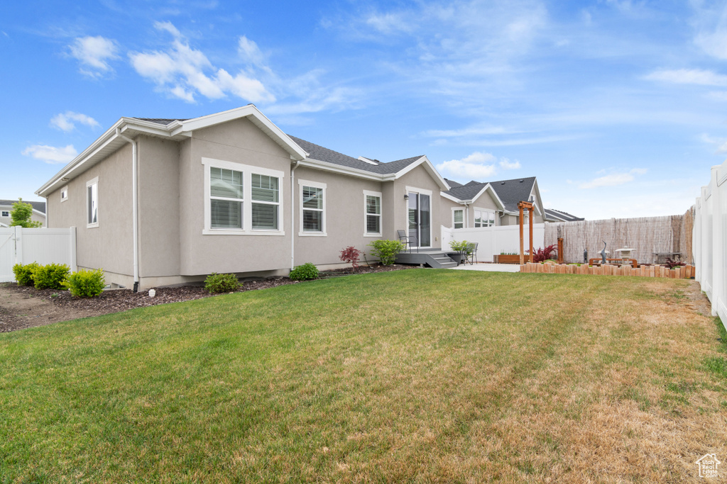 View of front of home featuring stucco siding