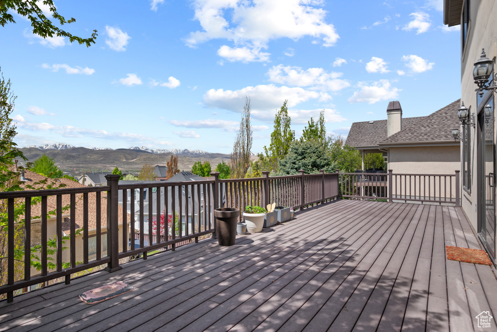 Wooden deck featuring a mountain view