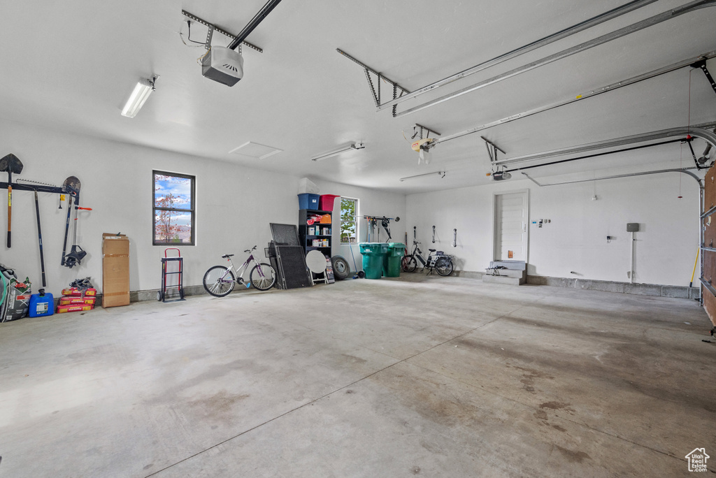 Garage featuring a garage door opener