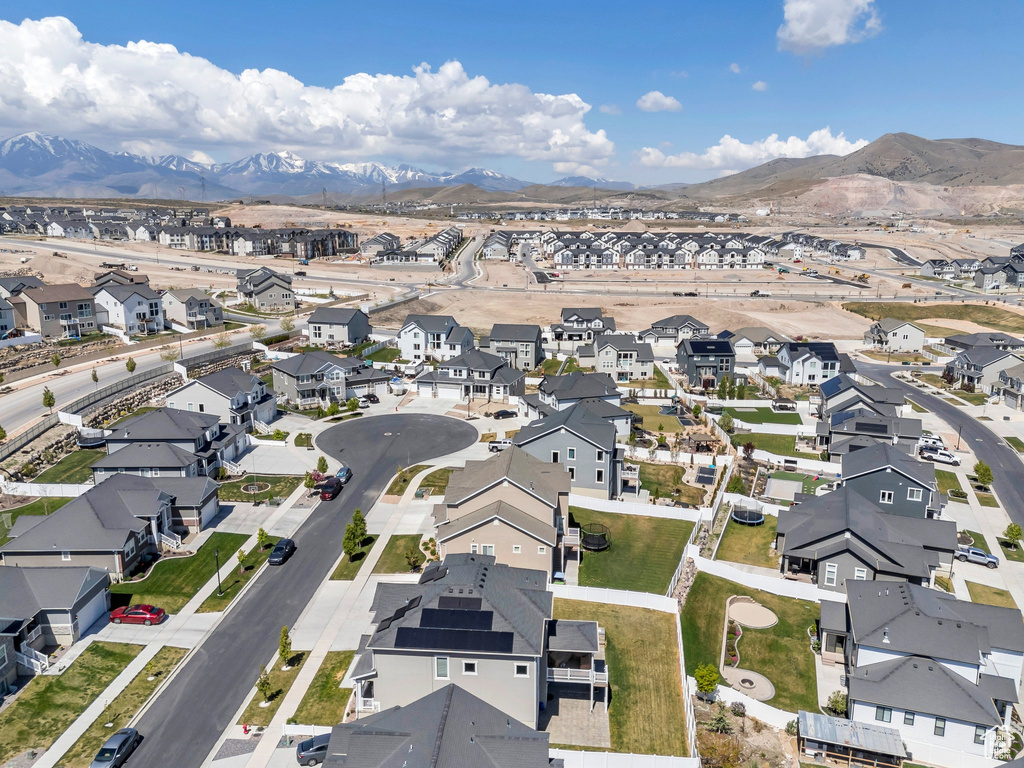 Drone / aerial view featuring a mountain view and a residential view