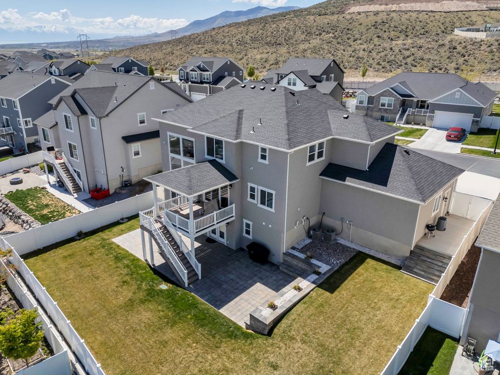 Drone / aerial view featuring a mountain view and a residential view
