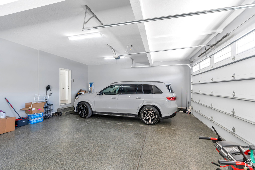 Garage featuring a garage door opener