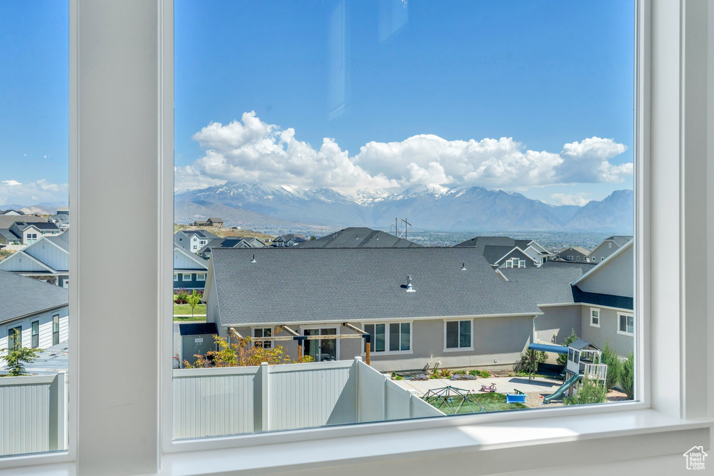 Property view of mountains with a residential view