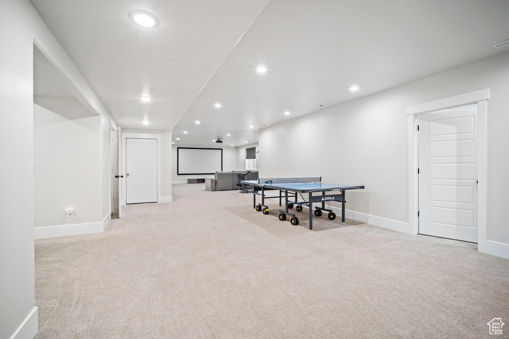 Game room featuring baseboards, visible vents, recessed lighting, and light colored carpet