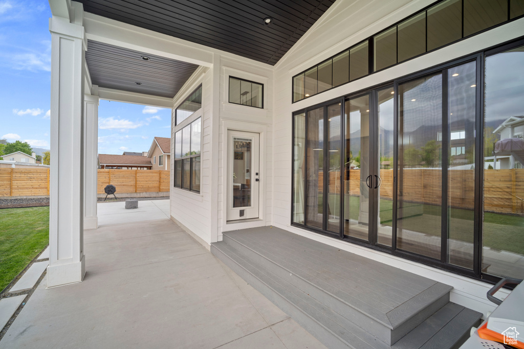 View of patio with fence