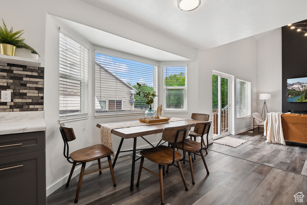 Dining area with baseboards and wood finished floors