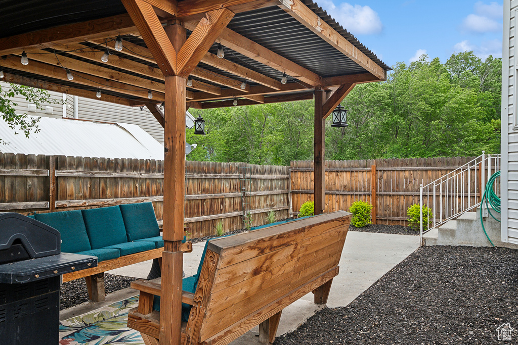 View of patio featuring outdoor lounge area and a fenced backyard