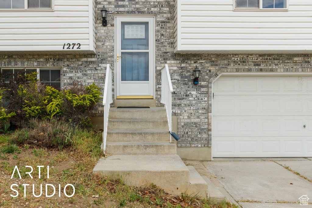 Property entrance featuring a garage