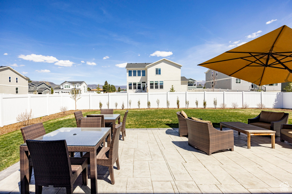 View of patio / terrace featuring outdoor dining area, a residential view, and outdoor lounge area