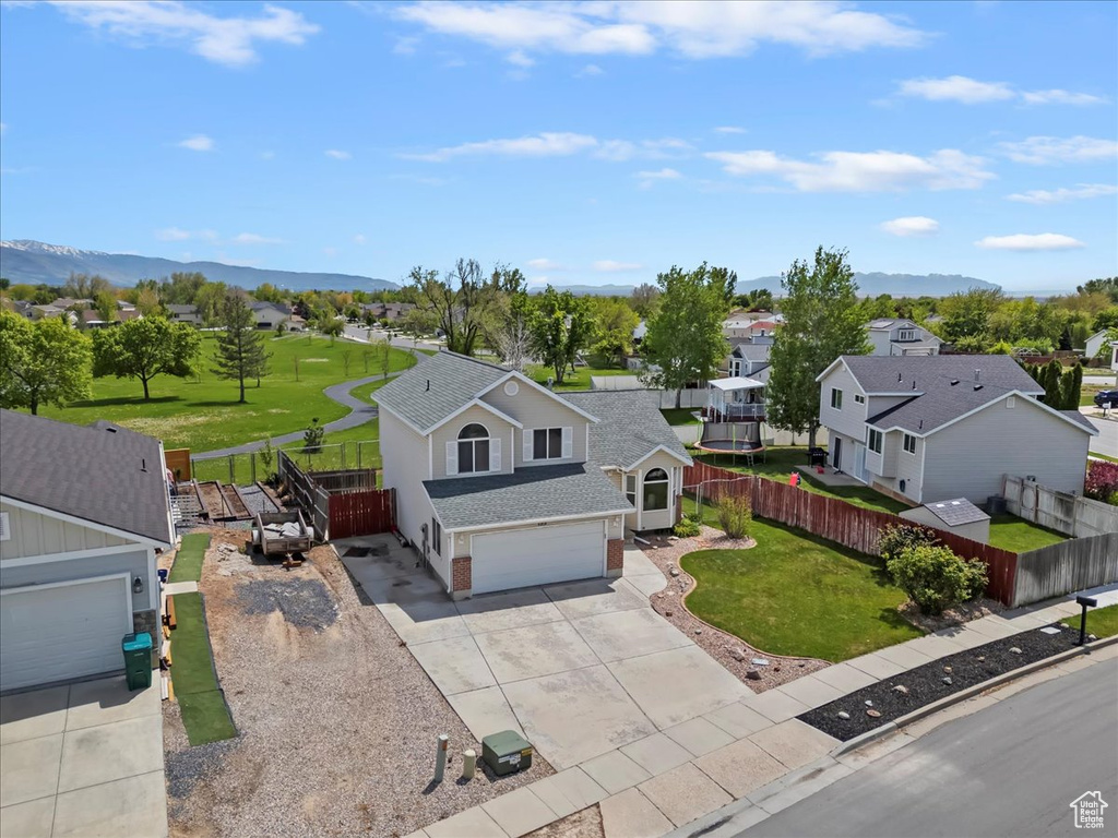 Aerial perspective of suburban area with a mountainous background