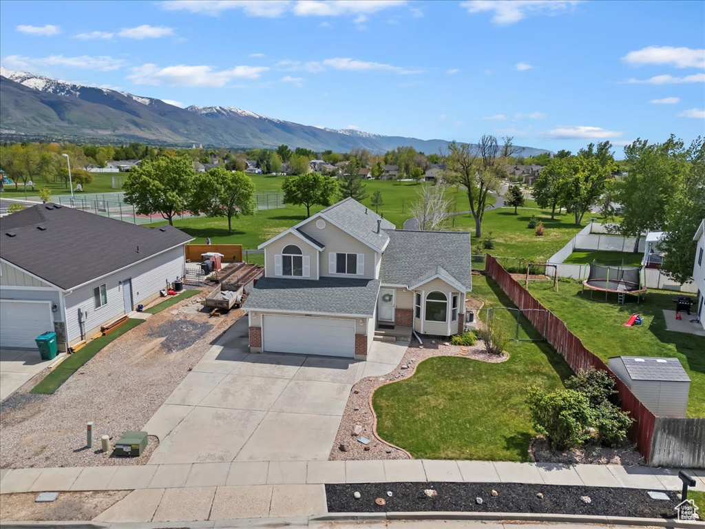 Aerial view of property and surrounding area with mountains