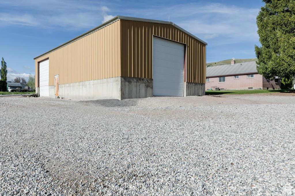 View of outdoor structure with an outbuilding