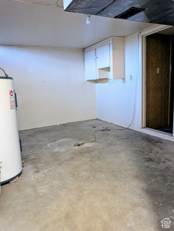 Finished basement featuring gas water heater