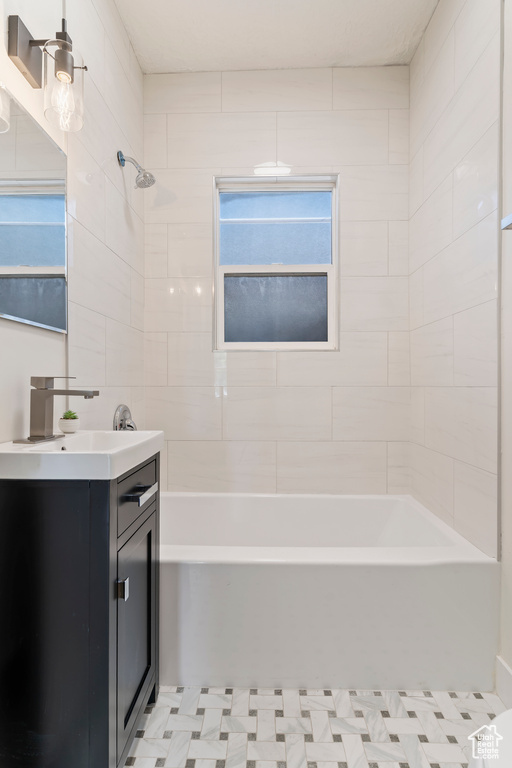 Full bath with vanity and tub / shower combination