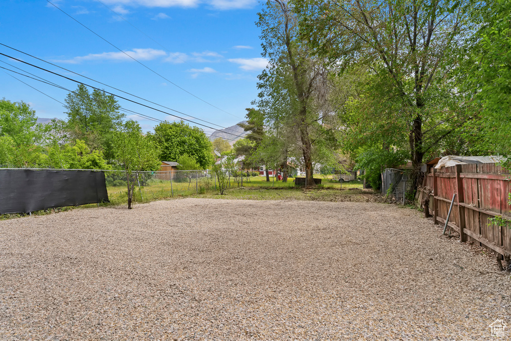 View of yard featuring fence