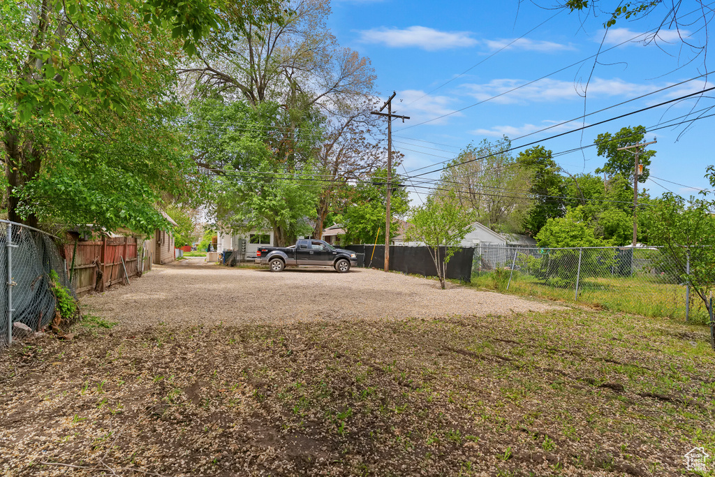 View of yard featuring fence