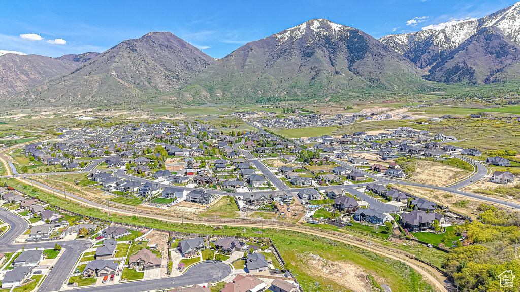View of property location featuring a mountainous background and nearby suburban area