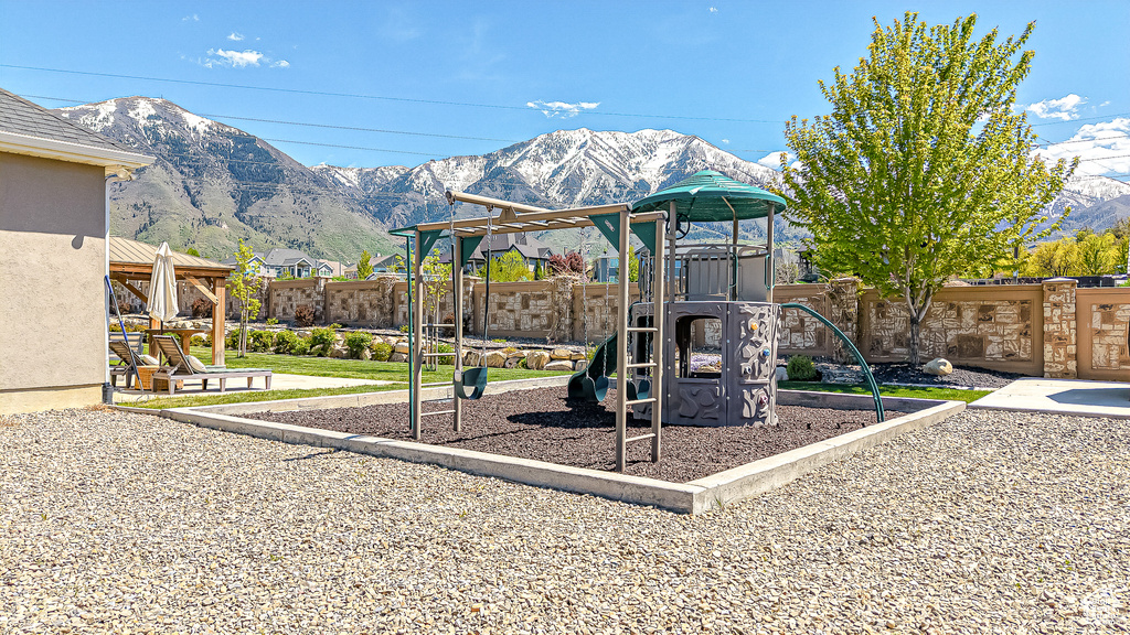 Community playground featuring a mountain view
