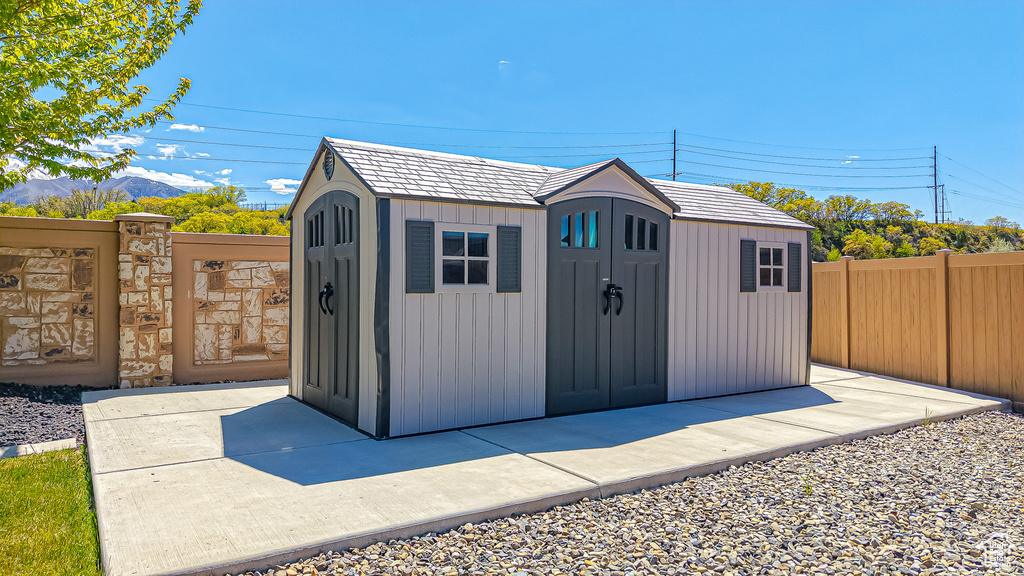 View of shed with fence