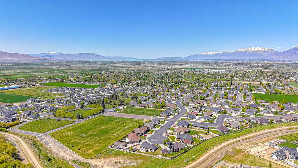 Aerial view of property\'s location with mountains and nearby suburban area
