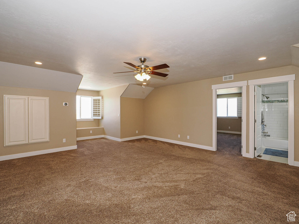 Additional living space featuring plenty of natural light, ceiling fan, baseboards, carpet flooring, and recessed lighting