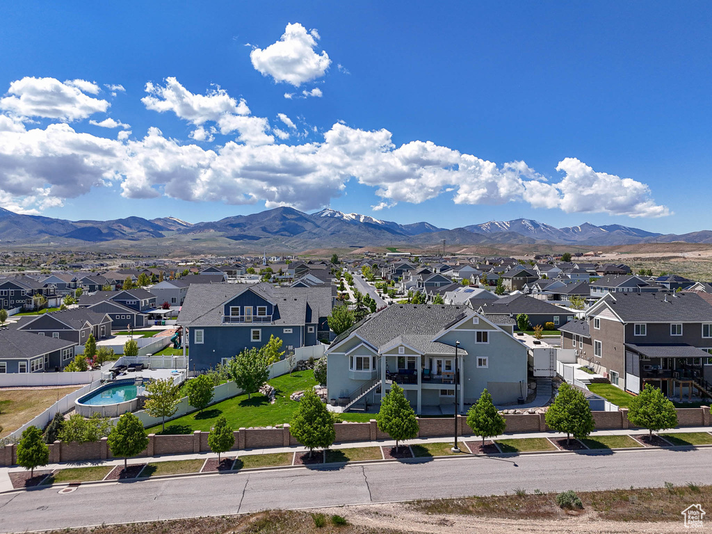 View of mountain backdrop featuring nearby suburban area