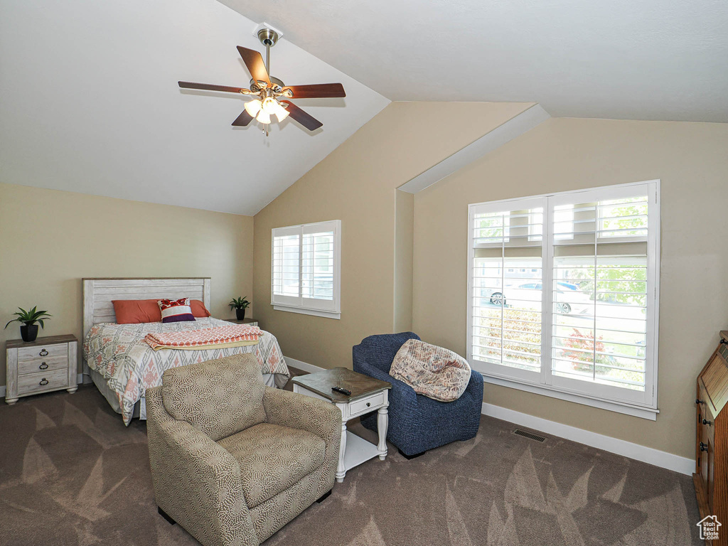 Bedroom with carpet flooring, lofted ceiling, baseboards, and a ceiling fan