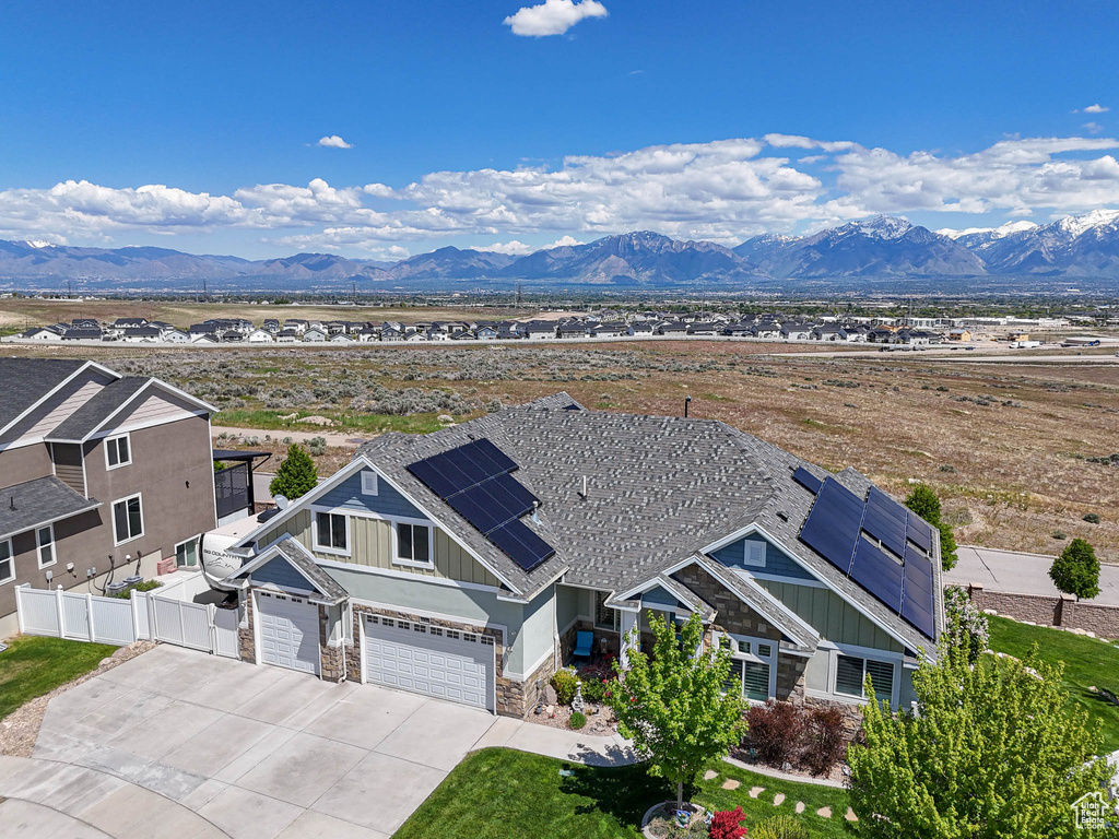 Aerial view of property and surrounding area with mountains