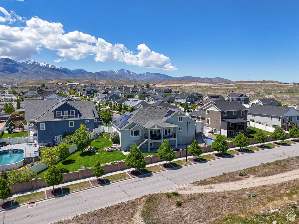 Aerial perspective of suburban area featuring a mountainous background
