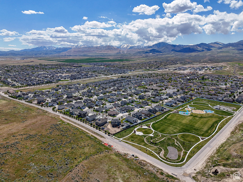 View of property location featuring a mountain backdrop and nearby suburban area