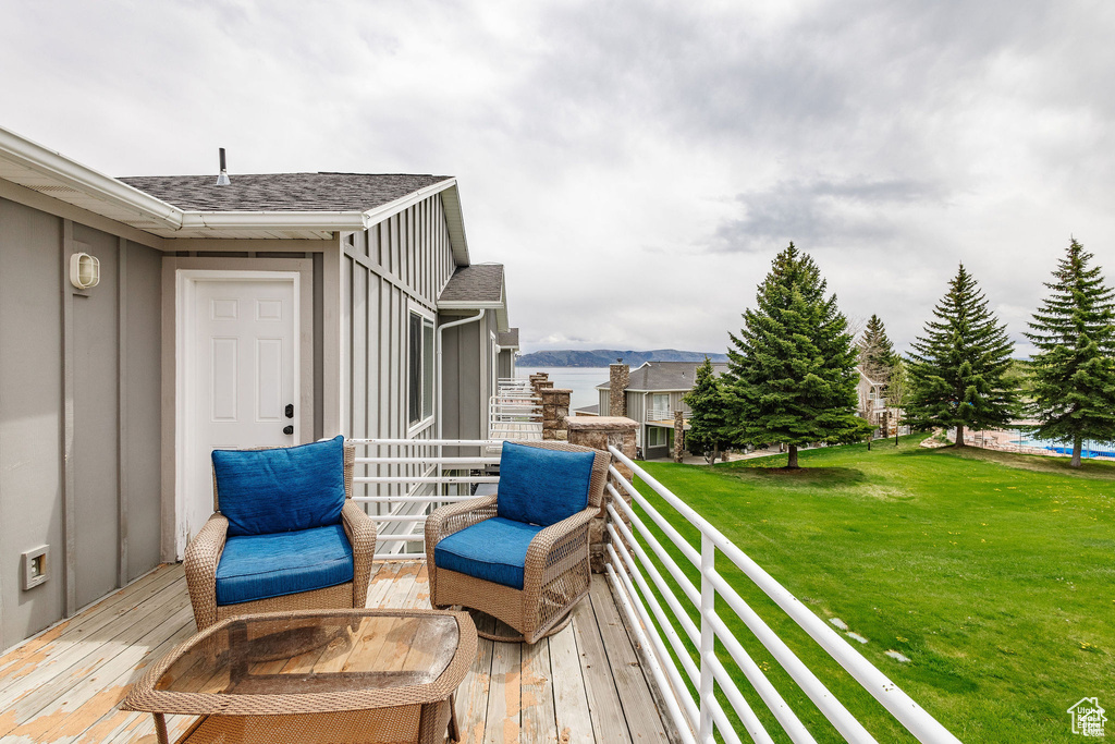 Wooden deck featuring a yard