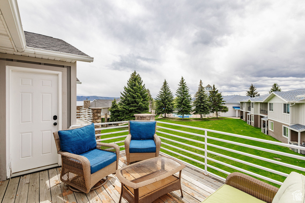 Deck featuring a lawn