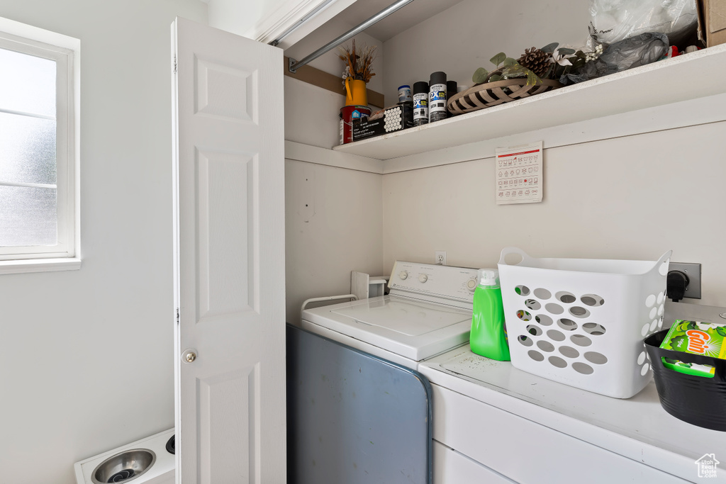 Laundry area featuring independent washer and dryer