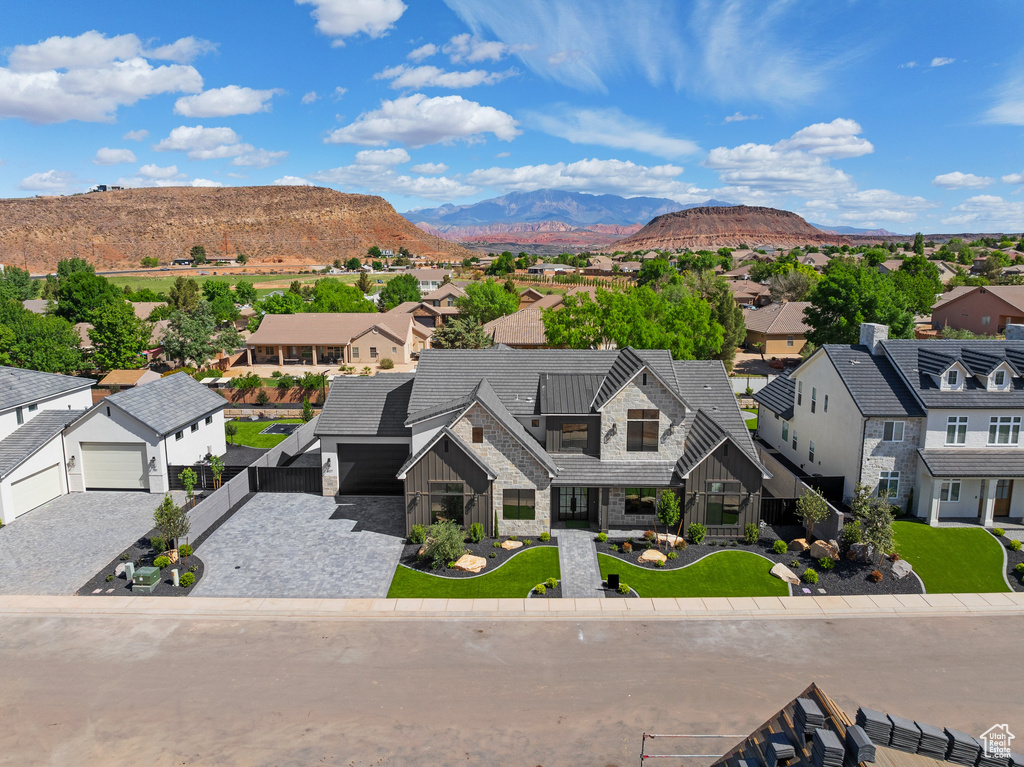 Aerial perspective of suburban area with a mountainous background