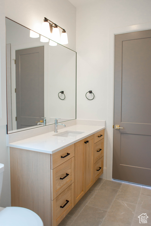 Bathroom with vanity and toilet