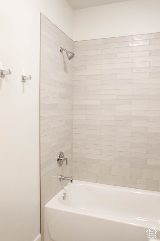 Full bathroom with shower / tub combination