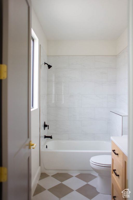 Full bath with shower / bath combination, vanity, and toilet