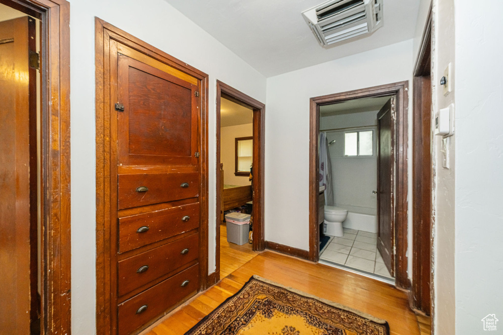 Hall featuring light wood-style floors and baseboards