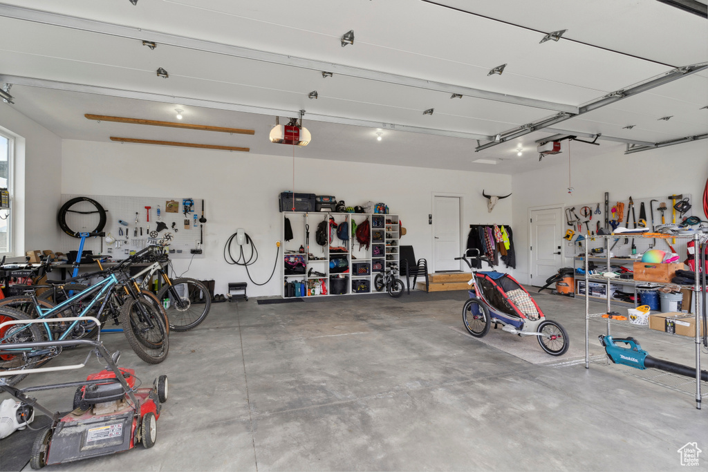 Garage featuring a garage door opener